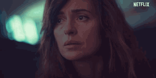 a close up of a woman 's face with the word netflix on the bottom