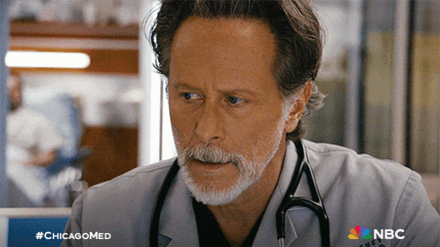 a doctor with a stethoscope around his neck and a nbc logo on his shirt