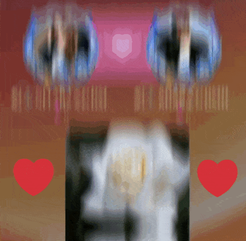 a blurry picture of a person 's face with a red heart in front of it