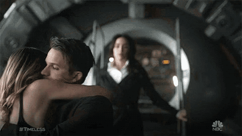 a man and a woman are hugging in a scene from timeless on nbc