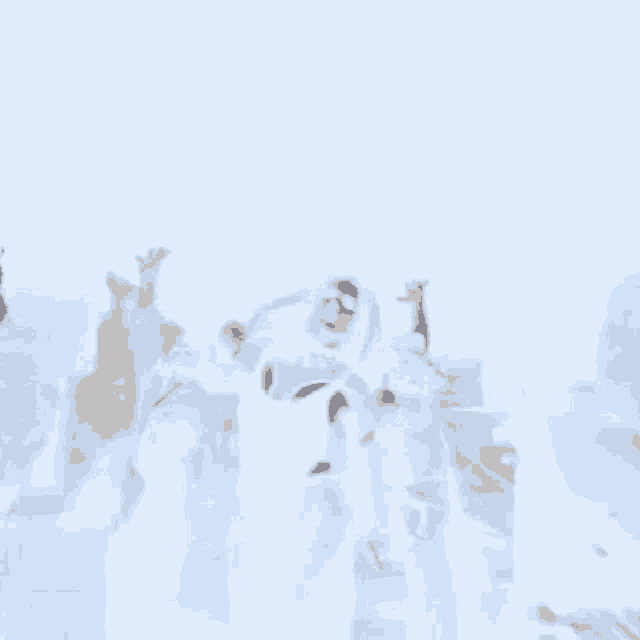 a group of people are standing in the snow with their arms up