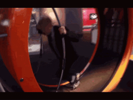 a person is riding a ferris wheel in a circle .