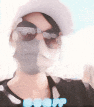 a blurry picture of a person wearing a mask