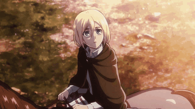 a girl in a cape sits on the back of a brown horse