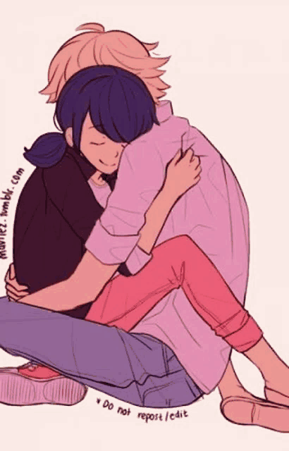 a man and a woman are hugging each other while sitting on the ground .