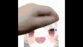 a close up of a person holding a glass of water .