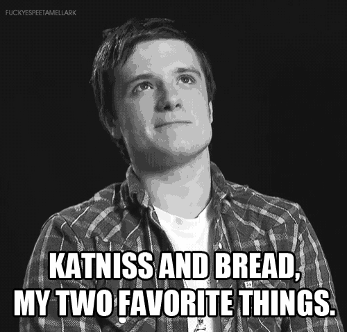 a black and white photo of a man with a caption that says katniss and bread my two favorite things
