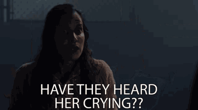 a woman in a dark room with the words have they heard her crying