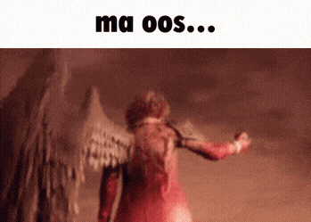 a woman in a red dress with wings is standing in the desert