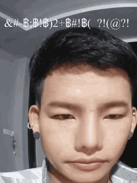 a close up of a young man 's face with the letters & # - b on the bottom