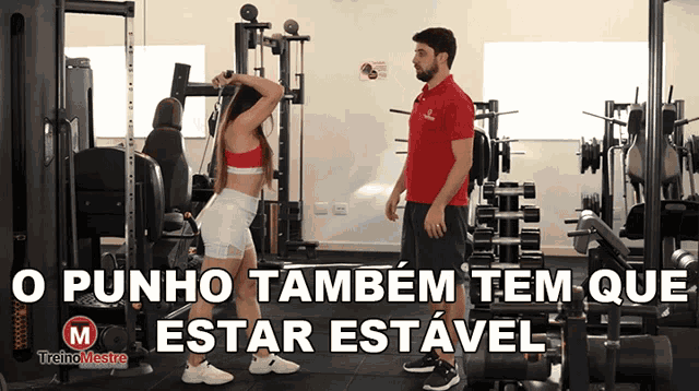 a man and a woman in a gym with the words o punho também tem que estar estavel below them