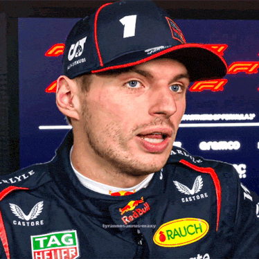 a close up of a man wearing a hat with the number 1 on it