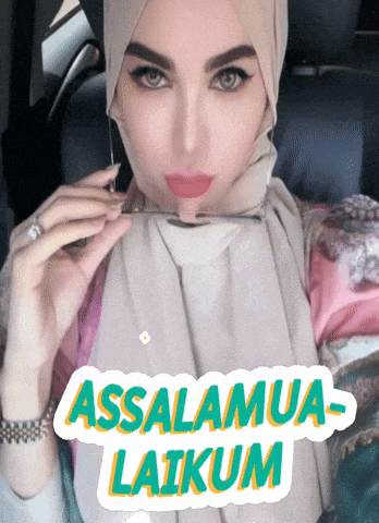 a woman wearing a hijab is holding a pair of glasses in front of a sticker that says assalamua laikum