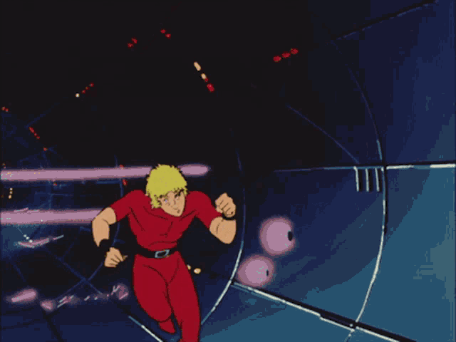 a man in a red shirt is upside down with his eyes closed
