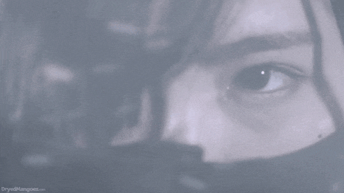 a close up of a woman 's face with a blurred background and the website bryanedmaggoes.com is visible