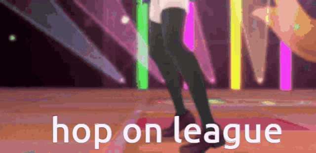 a person is dancing on a stage and the words hop on league are visible .