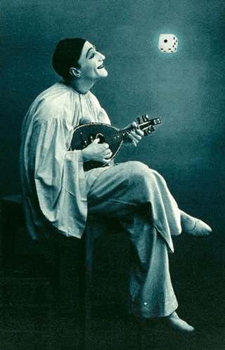 a man in a clown costume is playing a guitar while a dice is flying in the air
