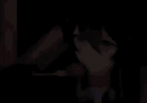 a person is eating a piece of food with a fork in their mouth