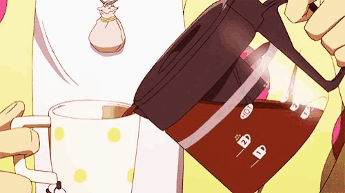a person is pouring a cup of coffee from a coffee maker