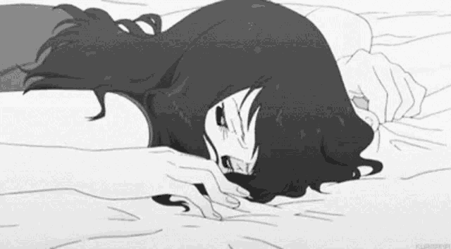 a black and white drawing of a girl laying on a bed with her head on the floor .