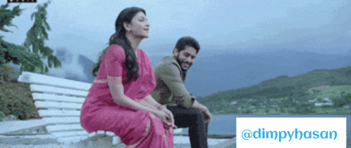 a man and a woman sit on a bench in front of a sign that says dimpyhasan