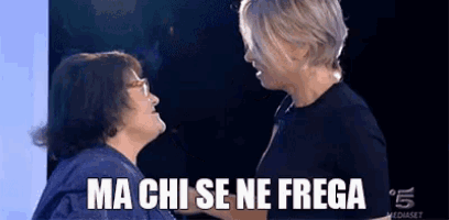 two women are standing next to each other and one of them is saying ma chi se ne frega .
