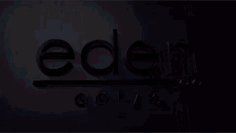 a neon sign that says eden copas in black