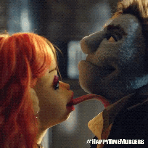 a doll is sticking its tongue out at a man in a happytimemurders ad
