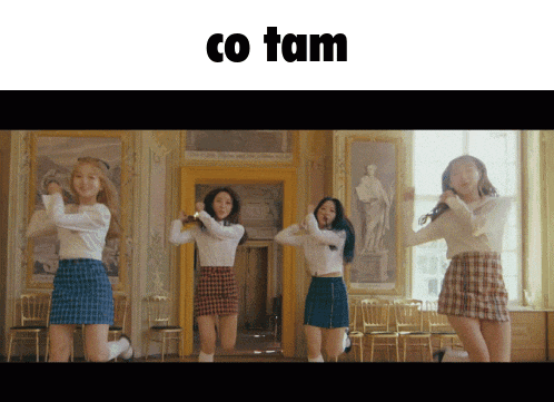 a group of girls are dancing in a room with the words co tam written above them
