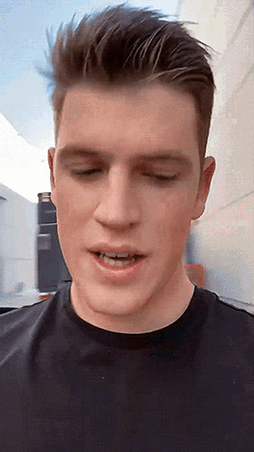 a close up of a man 's face with his eyes closed and his mouth open