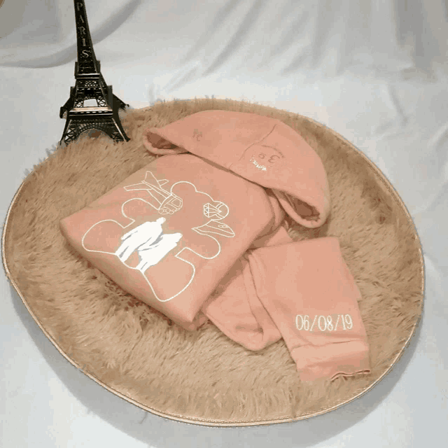 a pink hoodie with the date 06/08/19 written on it