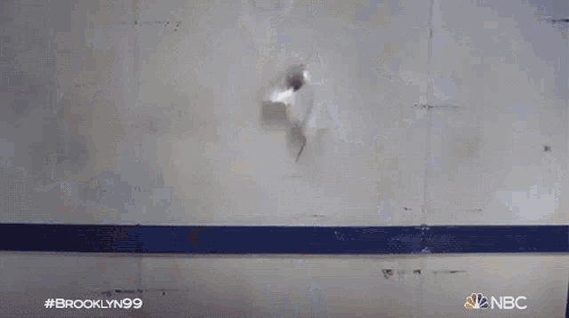 a nbc advertisement for brooklyn 99 shows smoke coming out of a building