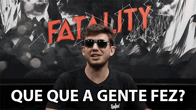 a man wearing sunglasses stands in front of a sign that says fatality que que a gente fez