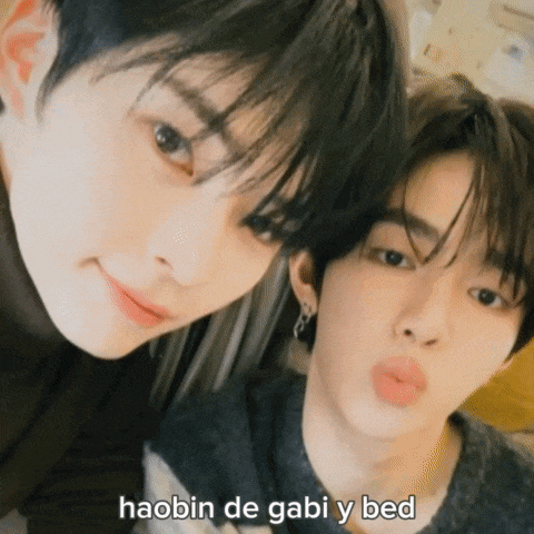 two young men are posing for a picture with the words haabin de gabi y bed below them