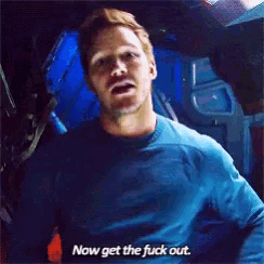 a man in a blue shirt says now get the fuck out .