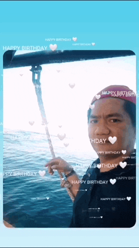 a man in a red hat is holding a fishing rod in front of a blue background that says happy birthday on it