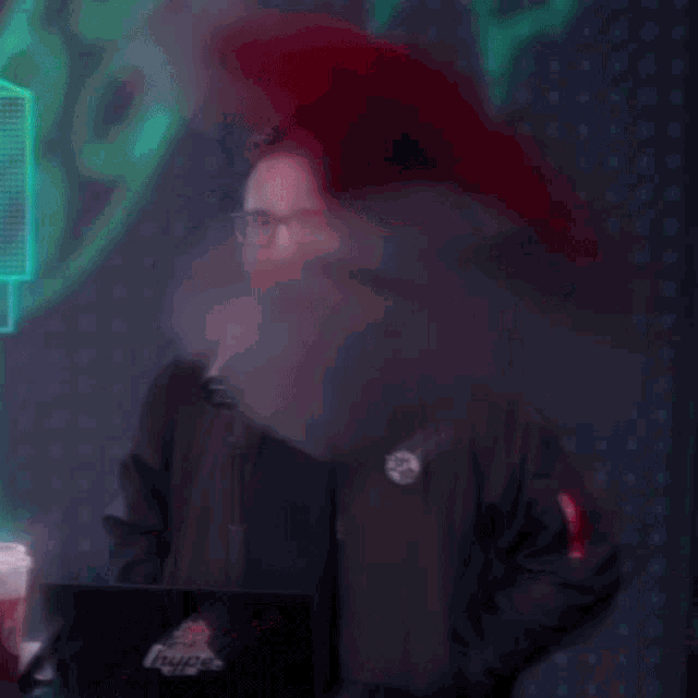 a blurry picture of a man wearing a santa hat and glasses