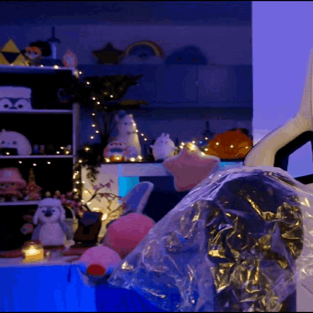 a room filled with lots of stuffed animals including a stuffed penguin