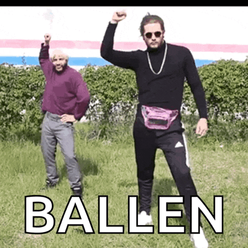 two men are standing in a field with the word ballen written on the ground .