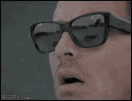 a man wearing sunglasses with the word enor written on it .