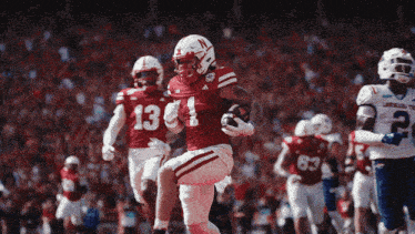 a football player wearing a jersey with the number 13 on it