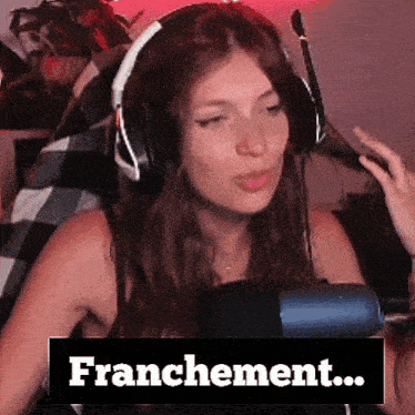 a woman wearing headphones and a microphone says " franchement " in front of her