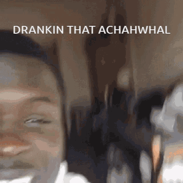 a close up of a man 's face with the words " drankin that achahwhal " written above him