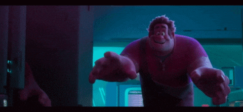 ralph from the movie wreck it ralph is standing in a dark room with his arms outstretched .