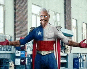 a man in a superhero costume is standing in a room with his arms outstretched and a mustache .