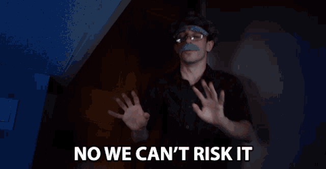 a man with a fake mustache and glasses says " no we can 't risk it "
