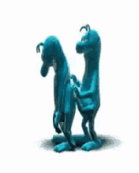 a couple of blue cartoon characters standing next to each other .