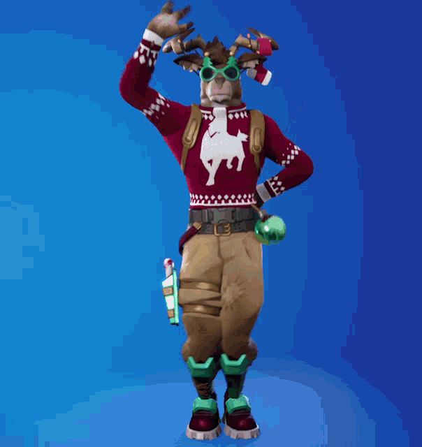 a reindeer is wearing a red sweater with a moose on it
