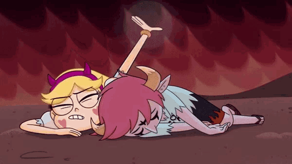 a couple of cartoon characters laying on the ground with one making a face