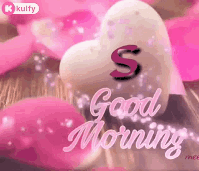 a pink heart with the letter s on it is surrounded by pink petals and the words `` good morning '' .